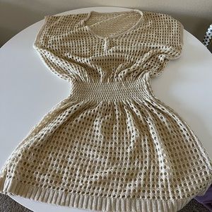 Medium crochet swim cover. Tapered elastic waist, 36” long. Only worn once.